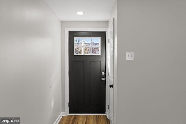 doorway to outside with wood-type flooring