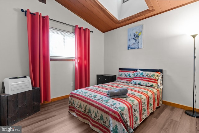 bedroom with wooden ceiling, lofted ceiling, and hardwood / wood-style flooring