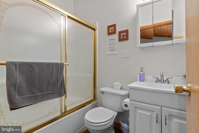 full bathroom featuring vanity, enclosed tub / shower combo, and toilet