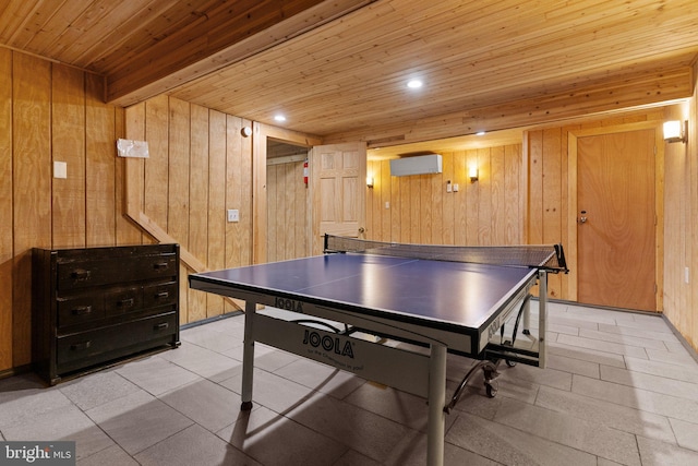 rec room featuring wood walls, wooden ceiling, beam ceiling, and a wall mounted AC