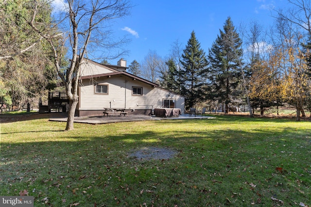 view of yard featuring a patio area and a deck