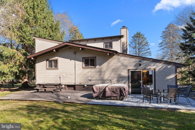 back of house featuring a yard and a patio