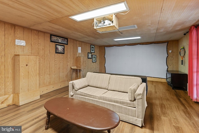 living room with wood walls, hardwood / wood-style floors, and wooden ceiling