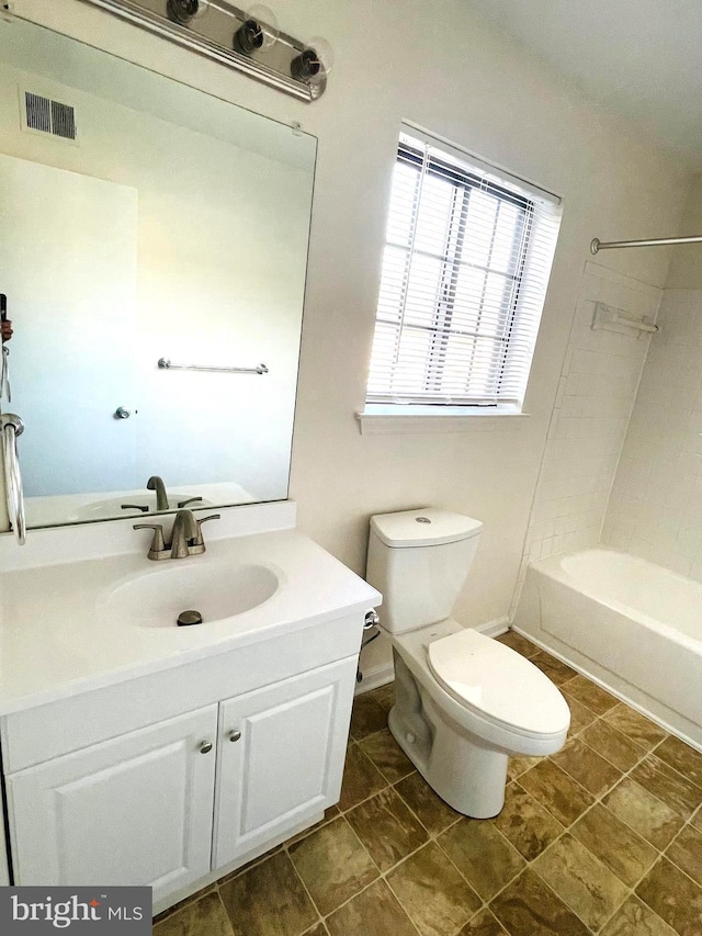 full bathroom with tile patterned flooring, vanity, toilet, and shower / washtub combination