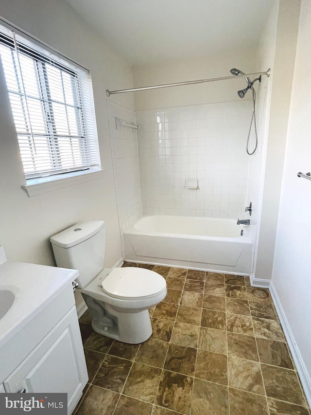 full bathroom featuring vanity, toilet, and tiled shower / bath combo