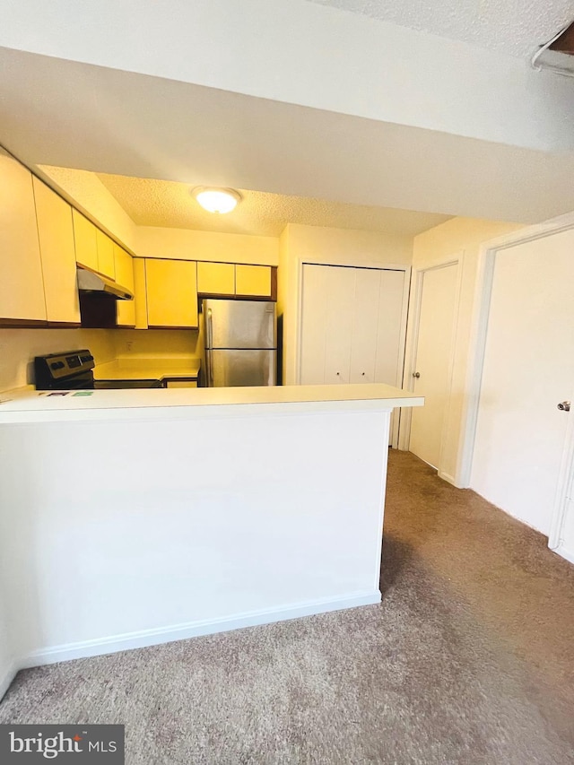 kitchen with light colored carpet, kitchen peninsula, range with electric cooktop, and stainless steel refrigerator