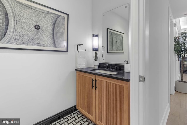 bathroom with vanity and hardwood / wood-style flooring