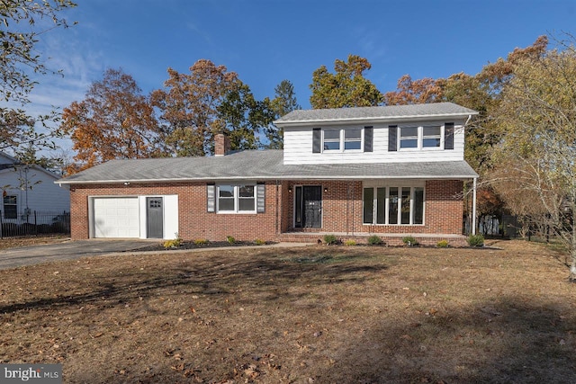 front facade with a garage and a porch