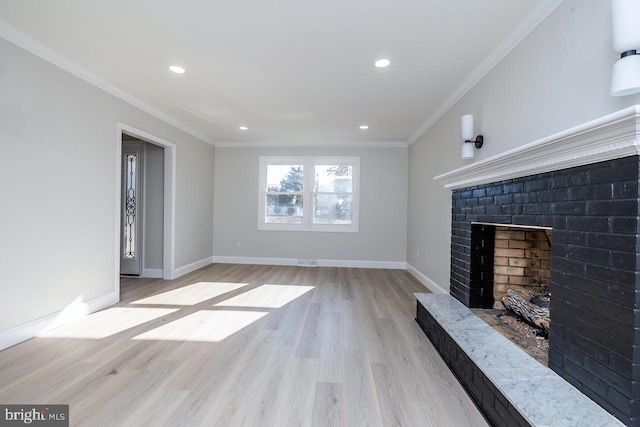 unfurnished living room with crown molding, a fireplace, and light hardwood / wood-style floors