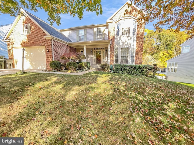 front of property featuring a front yard and a garage