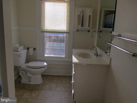 bathroom featuring vanity and toilet