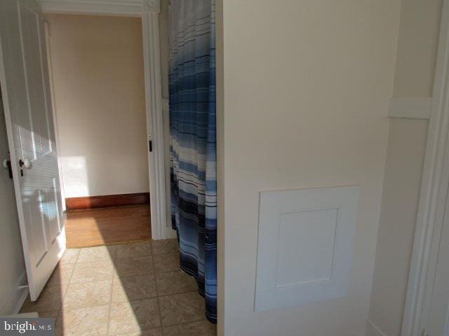 bathroom with tile patterned flooring and a shower with curtain