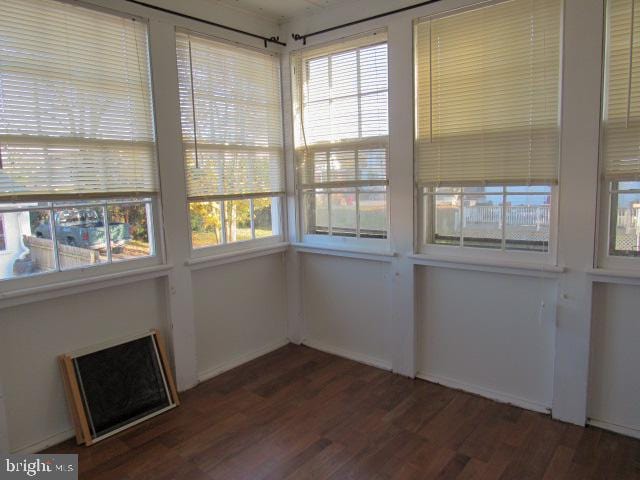 unfurnished sunroom featuring a wealth of natural light