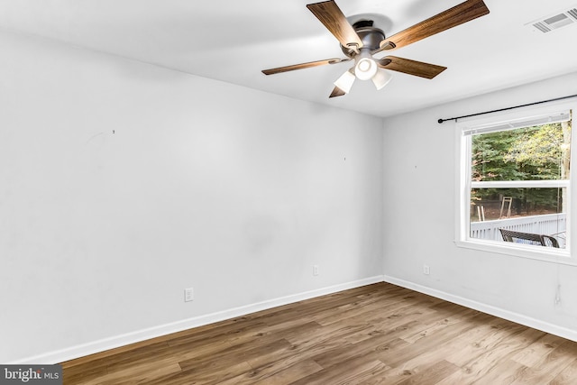 spare room with light hardwood / wood-style floors and ceiling fan