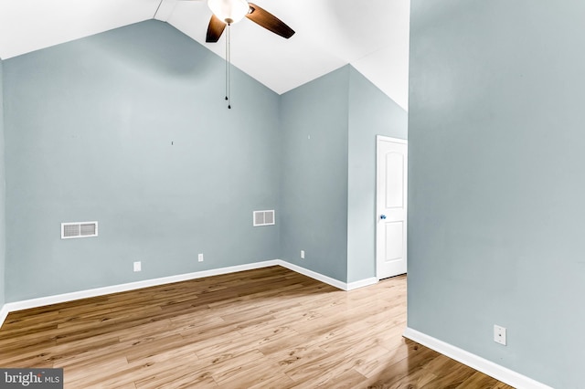 empty room featuring light hardwood / wood-style flooring, ceiling fan, and lofted ceiling