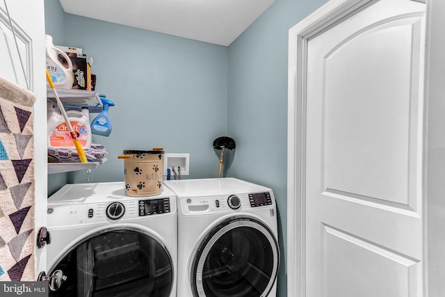 laundry area with washing machine and clothes dryer