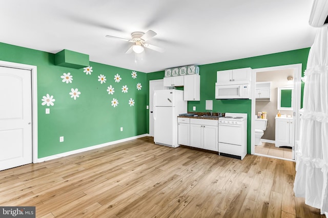 kitchen featuring white appliances, ceiling fan, sink, white cabinets, and light hardwood / wood-style floors