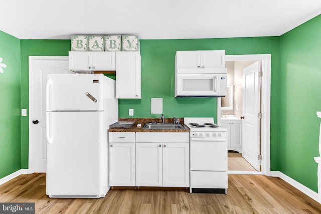 kitchen featuring white cabinetry, white appliances, sink, and light hardwood / wood-style flooring