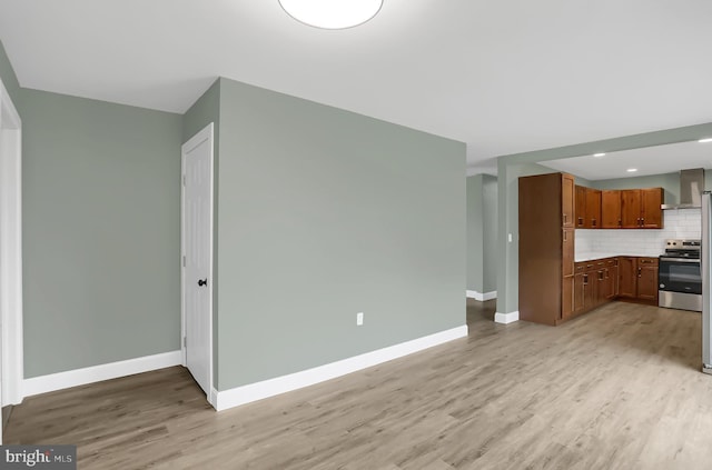 unfurnished living room with light hardwood / wood-style flooring