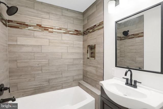 bathroom featuring sink and tiled shower / bath