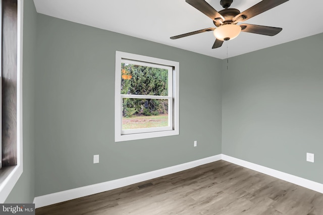 unfurnished room featuring ceiling fan and hardwood / wood-style floors