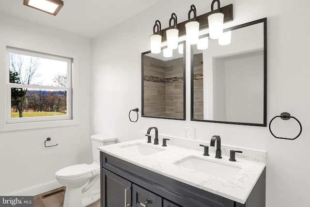 bathroom with hardwood / wood-style floors, vanity, and toilet