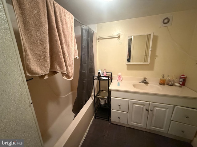 bathroom featuring vanity and shower / tub combo