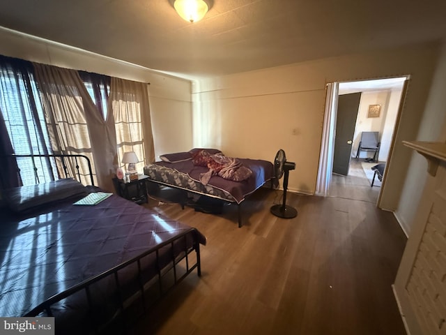 bedroom with hardwood / wood-style floors