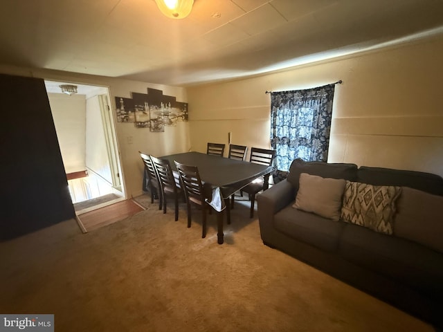 dining space with carpet