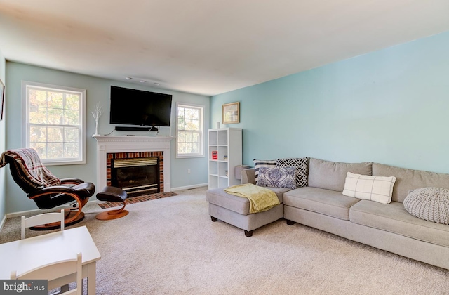 carpeted living room with a brick fireplace