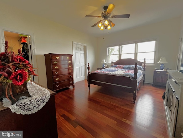 bedroom featuring dark hardwood / wood-style floors and ceiling fan