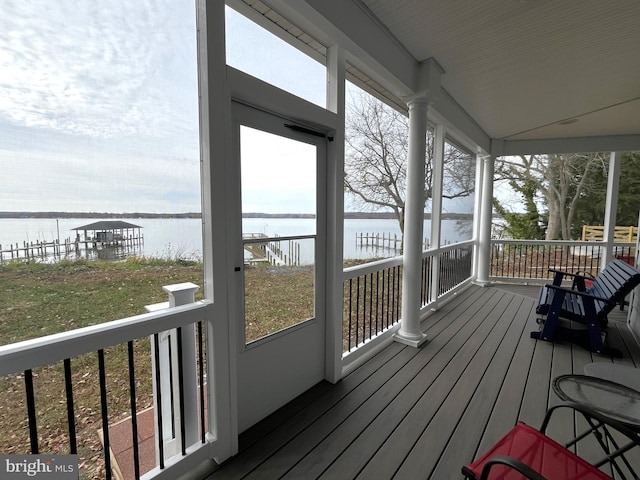 wooden deck with a water view