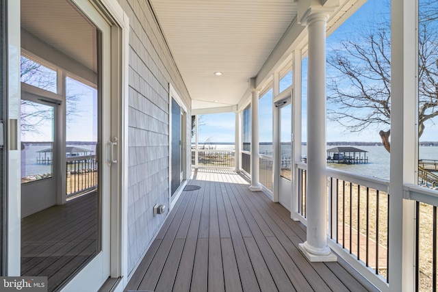 wooden deck featuring a water view