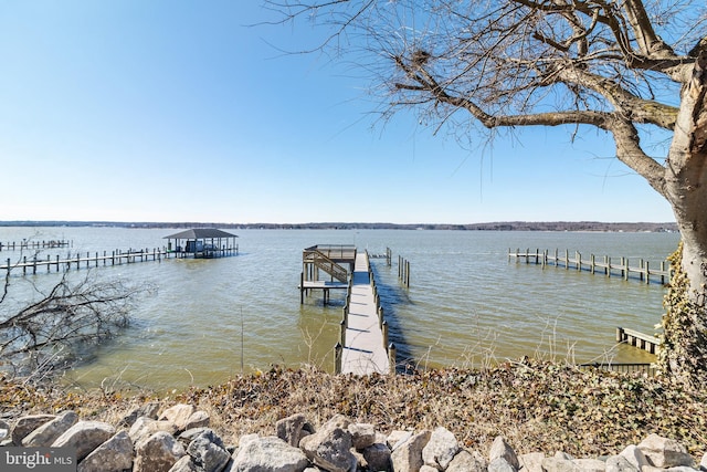 dock area featuring a water view