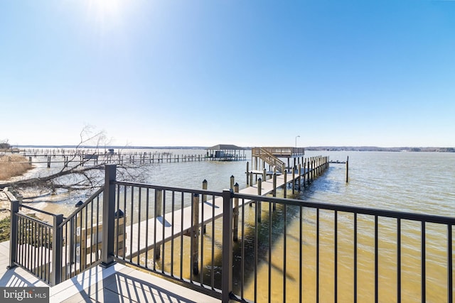 dock area featuring a water view