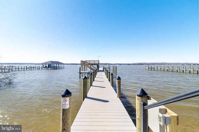 dock area featuring a water view