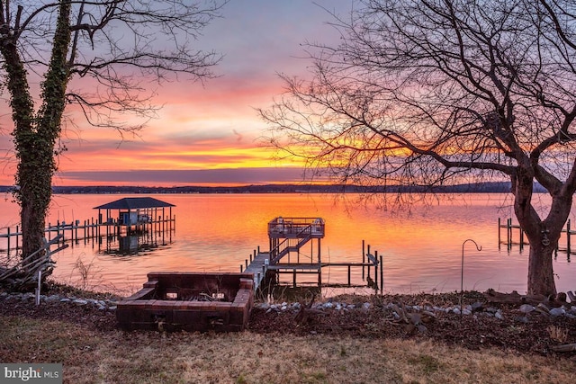 dock area with a water view