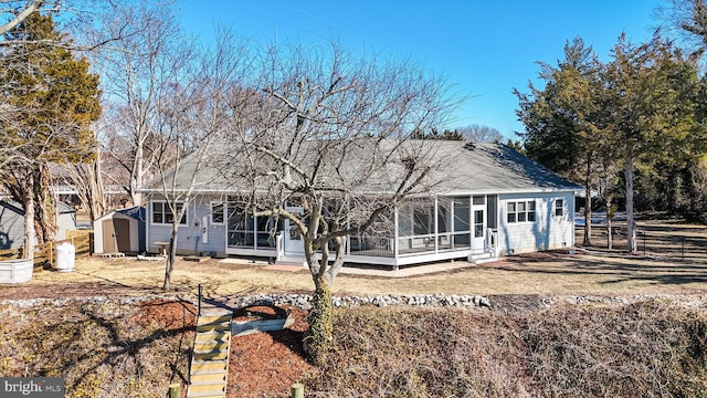 rear view of house with a shed