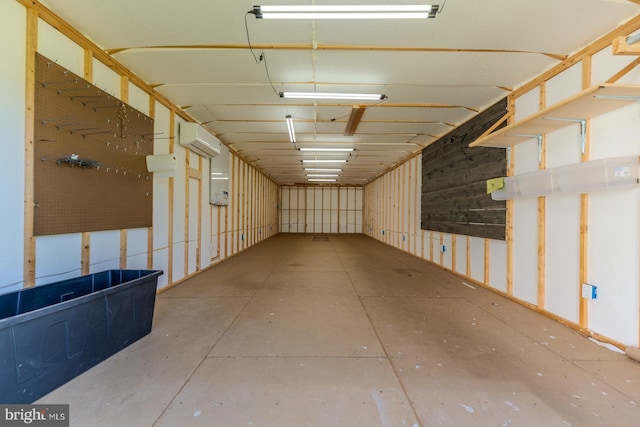 interior space with a wall mounted air conditioner