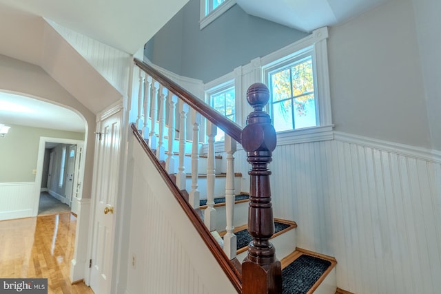 stairs with vaulted ceiling