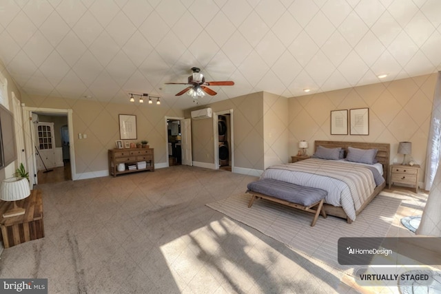 bedroom with an AC wall unit, light carpet, and ceiling fan