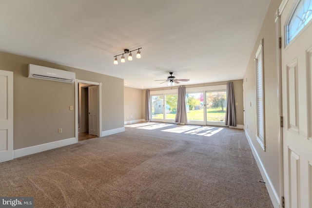 unfurnished living room featuring ceiling fan, an AC wall unit, and carpet flooring