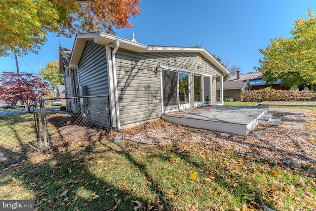 rear view of property featuring a patio