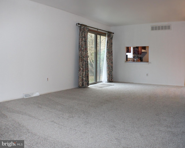 spare room featuring carpet flooring