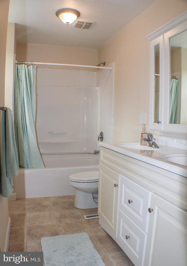 full bathroom featuring vanity, toilet, tile patterned floors, and shower / bath combination with curtain