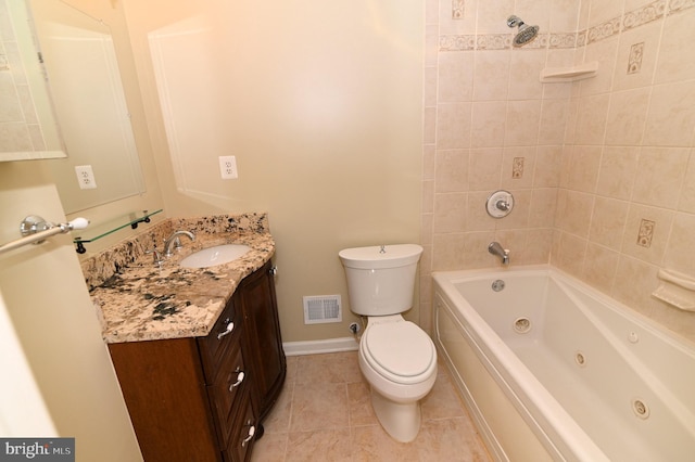 full bathroom with toilet, vanity, tiled shower / bath, and tile patterned flooring