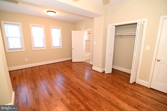 unfurnished bedroom with hardwood / wood-style flooring