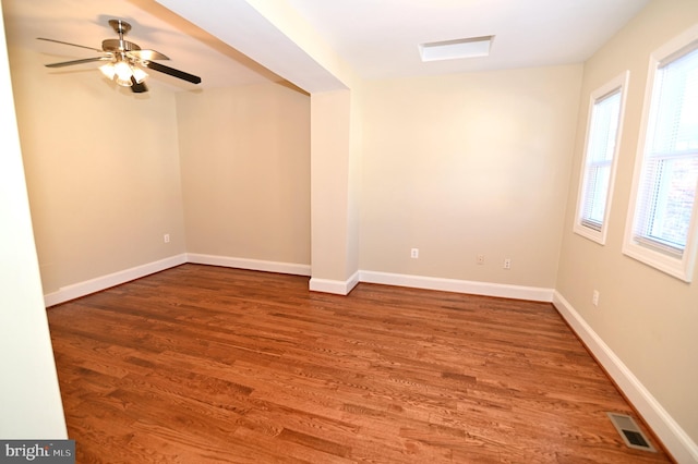 spare room with hardwood / wood-style flooring and ceiling fan