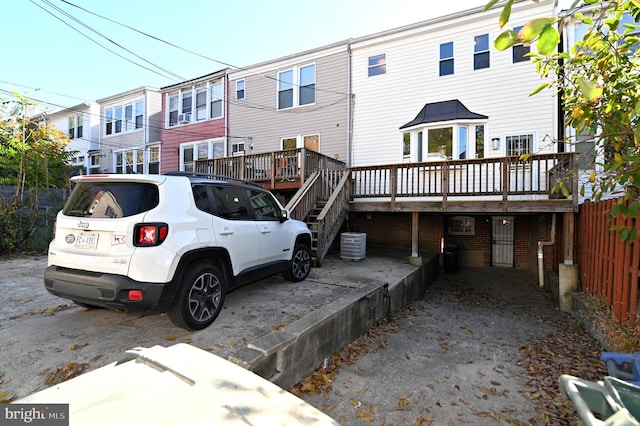 back of property featuring a deck