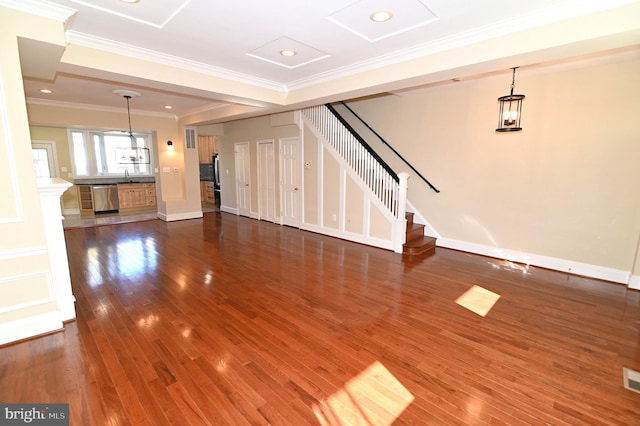 unfurnished living room featuring sink, a notable chandelier, dark hardwood / wood-style floors, and crown molding